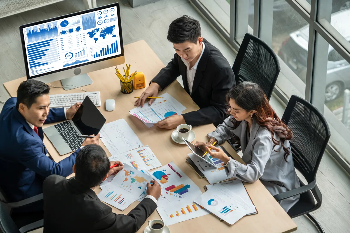 A business team reviewing an operations dashboard together