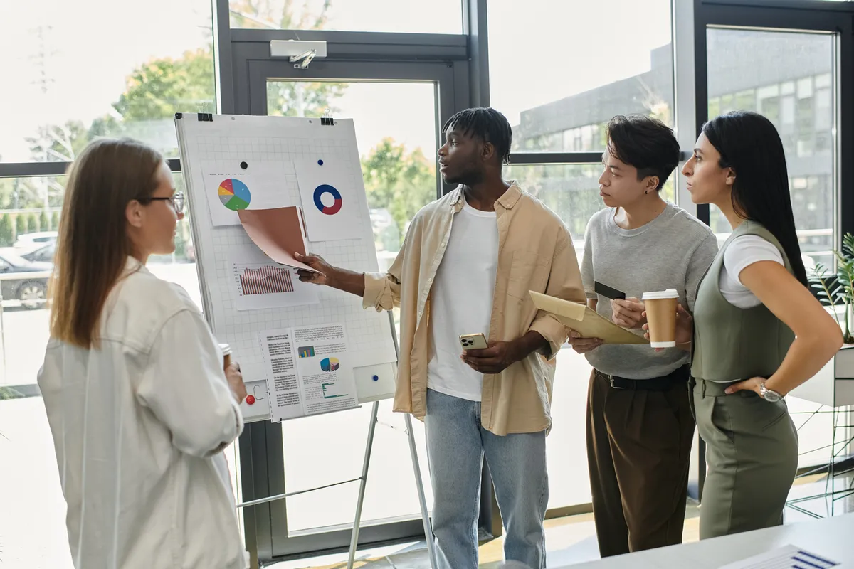 A startup team planning growth together at a whiteboard