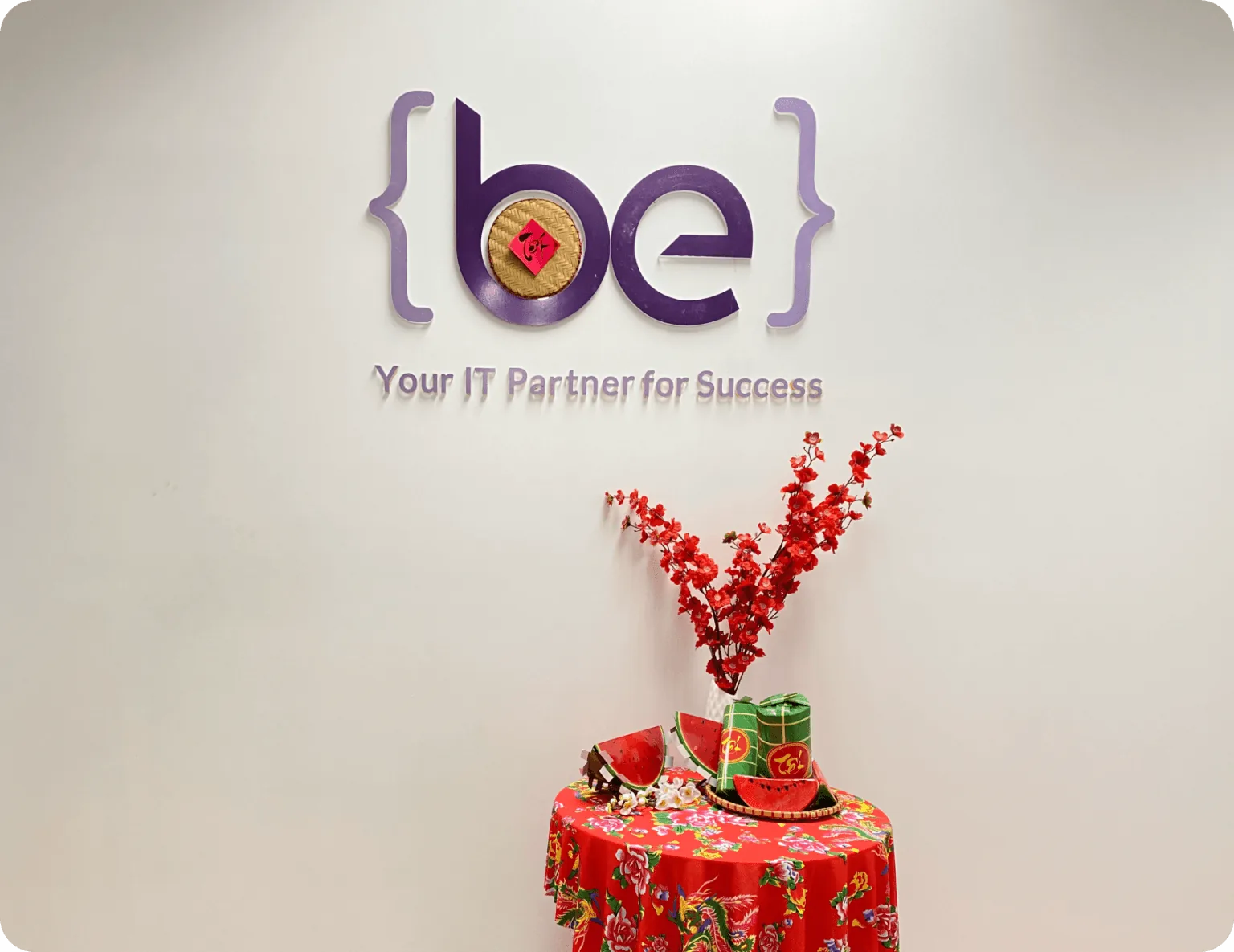 The BeyondEdge logo on the reception wall, decorated for Lunar New Year