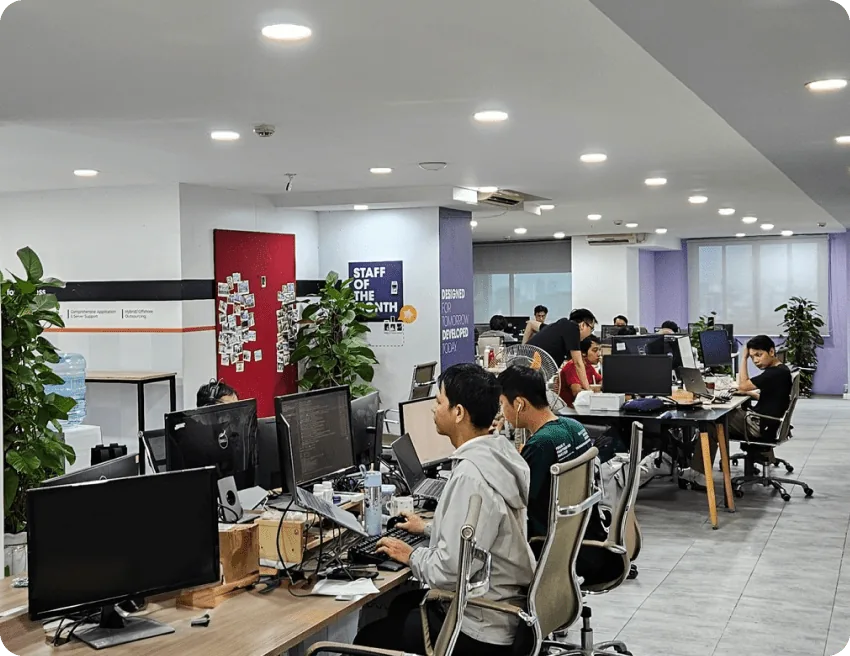 Open-plan workspace with the team at their desks